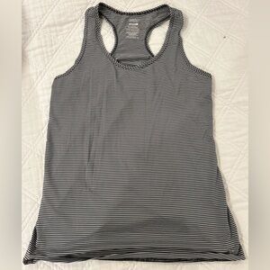 Walmart. Women’s medium, black/white stripped athletic tank top.